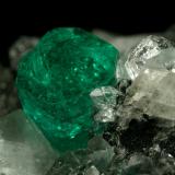 Beryl (variety emerald), Calcite, Quartz<br />Muzo mining district, Western Emerald Belt, Boyacá Department, Colombia<br />60x46x42mm, xl=13mm<br /> (Author: Fiebre Verde)