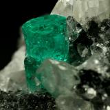 Beryl (variety emerald), Calcite, Quartz<br />Muzo mining district, Western Emerald Belt, Boyacá Department, Colombia<br />60x46x42mm, xl=13mm<br /> (Author: Fiebre Verde)