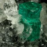 Beryl (variety emerald), Calcite, Quartz<br />Muzo mining district, Western Emerald Belt, Boyacá Department, Colombia<br />60x46x42mm, xl=13mm<br /> (Author: Fiebre Verde)