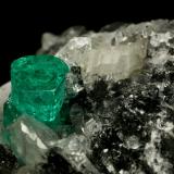 Beryl (variety emerald), Calcite, Quartz<br />Muzo mining district, Western Emerald Belt, Boyacá Department, Colombia<br />60x46x42mm, xl=13mm<br /> (Author: Fiebre Verde)