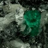 Beryl (variety emerald), Calcite, Quartz<br />Muzo mining district, Western Emerald Belt, Boyacá Department, Colombia<br />60x46x42mm, xl=13mm<br /> (Author: Fiebre Verde)