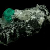 Beryl (variety emerald), Calcite, Quartz<br />Muzo mining district, Western Emerald Belt, Boyacá Department, Colombia<br />60x46x42mm, xl=13mm<br /> (Author: Fiebre Verde)