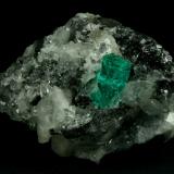 Beryl (variety emerald), Calcite, Quartz<br />Muzo mining district, Western Emerald Belt, Boyacá Department, Colombia<br />60x46x42mm, xl=13mm<br /> (Author: Fiebre Verde)