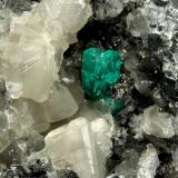 Beryl (variety emerald), Calcite<br />La Pita mining district, Municipio Maripí, Western Emerald Belt, Boyacá Department, Colombia<br />9cm across, xls=20mm<br /> (Author: Fiebre Verde)