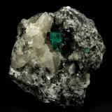 Beryl (variety emerald), Calcite<br />La Pita mining district, Municipio Maripí, Western Emerald Belt, Boyacá Department, Colombia<br />9cm across, xls=20mm<br /> (Author: Fiebre Verde)