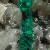 Beryl (variety emerald), Calcite, Pyrite<br />Chivor mining district, Municipio Chivor, Eastern Emerald Belt, Boyacá Department, Colombia<br />65x50x70mm, xl=18mm<br /> (Author: Fiebre Verde)