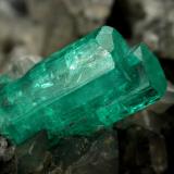 Beryl (variety emerald), Calcite<br />La Pita mining district, Polveros Mine, Municipio Maripí, Western Emerald Belt, Boyacá Department, Colombia<br />37x45mm, xl=34mm<br /> (Author: Fiebre Verde)