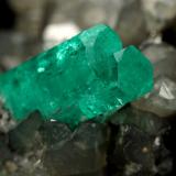 Beryl (variety emerald), Calcite<br />La Pita mining district, Polveros Mine, Municipio Maripí, Western Emerald Belt, Boyacá Department, Colombia<br />37x45mm, xl=34mm<br /> (Author: Fiebre Verde)