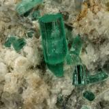 Beryl (variety emerald), Calcite, Aragonite<br />Chivor mining district, Municipio Chivor, Eastern Emerald Belt, Boyacá Department, Colombia<br />80x70x65mm, main xl=18mm<br /> (Author: Fiebre Verde)