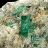 Beryl (variety emerald), Calcite, Aragonite<br />Chivor mining district, Municipio Chivor, Eastern Emerald Belt, Boyacá Department, Colombia<br />80x70x65mm, main xl=18mm<br /> (Author: Fiebre Verde)