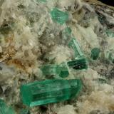 Beryl (variety emerald), Calcite, Aragonite<br />Chivor mining district, Municipio Chivor, Eastern Emerald Belt, Boyacá Department, Colombia<br />80x70x65mm, main xl=18mm<br /> (Author: Fiebre Verde)