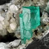 Beryl (variety emerald), Calcite<br />La Pita mining district, Polveros Mine, Municipio Maripí, Western Emerald Belt, Boyacá Department, Colombia<br />115x75x115mm, xl=20mm<br /> (Author: Fiebre Verde)