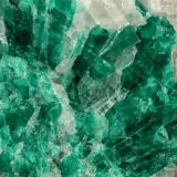 Beryl (variety emerald), Calcite<br />La Pita mining district, Municipio Maripí, Western Emerald Belt, Boyacá Department, Colombia<br />7cm across<br /> (Author: Fiebre Verde)