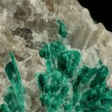 Beryl (variety emerald), Calcite<br />La Pita mining district, Municipio Maripí, Western Emerald Belt, Boyacá Department, Colombia<br />7cm across<br /> (Author: Fiebre Verde)