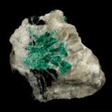 Beryl (variety emerald), Calcite<br />La Pita mining district, Municipio Maripí, Western Emerald Belt, Boyacá Department, Colombia<br />7cm across<br /> (Author: Fiebre Verde)