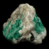 Beryl (variety emerald), Calcite<br />La Pita mining district, Municipio Maripí, Western Emerald Belt, Boyacá Department, Colombia<br />7cm across<br /> (Author: Fiebre Verde)