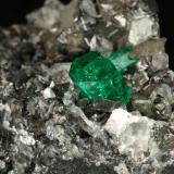 Beryl (variety emerald), Calcite<br />La Pita mining district, Municipio Maripí, Western Emerald Belt, Boyacá Department, Colombia<br />83x27x62mm, xl=9mm<br /> (Author: Fiebre Verde)