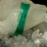 Beryl (variety emerald), Calcite<br />La Pita mining district, Polveros Mine, Municipio Maripí, Western Emerald Belt, Boyacá Department, Colombia<br />90x60x65mm, xl=16mm<br /> (Author: Fiebre Verde)