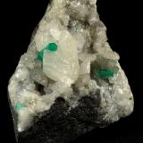 Beryl (variety emerald), Calcite<br />La Pita mining district, Polveros Mine, Municipio Maripí, Western Emerald Belt, Boyacá Department, Colombia<br />90x60x65mm, xl=16mm<br /> (Author: Fiebre Verde)