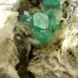 Beryl (variety emerald), Calcite, Aragonite<br />Chivor mining district, Municipio Chivor, Eastern Emerald Belt, Boyacá Department, Colombia<br />75x55x65mm, main xl~1cm<br /> (Author: Fiebre Verde)