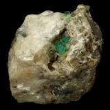 Beryl (variety emerald), Calcite, Aragonite<br />Chivor mining district, Municipio Chivor, Eastern Emerald Belt, Boyacá Department, Colombia<br />75x55x65mm, main xl~1cm<br /> (Author: Fiebre Verde)