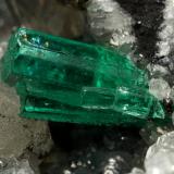 Beryl (variety emerald), Calcite, Pyrite<br />La Pita mining district, Municipio Maripí, Western Emerald Belt, Boyacá Department, Colombia<br />54x36x60mm, xl=8mm<br /> (Author: Fiebre Verde)