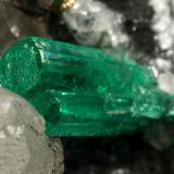 Beryl (variety emerald), Calcite, Pyrite<br />La Pita mining district, Municipio Maripí, Western Emerald Belt, Boyacá Department, Colombia<br />54x36x60mm, xl=8mm<br /> (Author: Fiebre Verde)