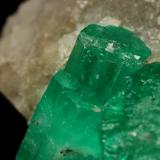 Beryl (variety emerald), Calcite<br />Muzo mining district, Western Emerald Belt, Boyacá Department, Colombia<br />60x47x49mm, central xl=16mm<br /> (Author: Fiebre Verde)