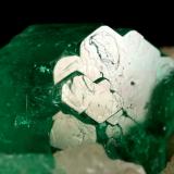 Beryl (variety emerald), Calcite<br />Muzo mining district, Western Emerald Belt, Boyacá Department, Colombia<br />60x47x49mm, central xl=16mm<br /> (Author: Fiebre Verde)