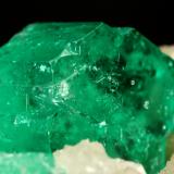 Beryl (variety emerald), Calcite<br />Muzo mining district, Western Emerald Belt, Boyacá Department, Colombia<br />60x47x49mm, central xl=16mm<br /> (Author: Fiebre Verde)