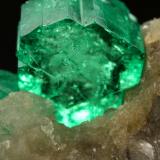 Beryl (variety emerald), Calcite<br />Muzo mining district, Western Emerald Belt, Boyacá Department, Colombia<br />60x47x49mm, central xl=16mm<br /> (Author: Fiebre Verde)