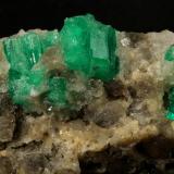 Beryl (variety emerald), Calcite<br />Muzo mining district, Western Emerald Belt, Boyacá Department, Colombia<br />60x47x49mm, central xl=16mm<br /> (Author: Fiebre Verde)