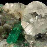 Beryl (variety emerald), Calcite<br />La Pita mining district, Polveros Mine, Municipio Maripí, Western Emerald Belt, Boyacá Department, Colombia<br />110x85x85mm, xl=30mm<br /> (Author: Fiebre Verde)