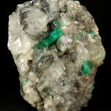 Beryl (variety emerald), Calcite<br />La Pita mining district, Polveros Mine, Municipio Maripí, Western Emerald Belt, Boyacá Department, Colombia<br />110x85x85mm, xl=30mm<br /> (Author: Fiebre Verde)