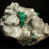 Beryl (variety emerald), Calcite<br />La Pita mining district, Polveros Mine, Municipio Maripí, Western Emerald Belt, Boyacá Department, Colombia<br />110x85x85mm, xl=30mm<br /> (Author: Fiebre Verde)