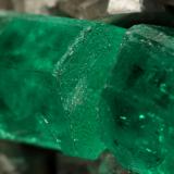 Beryl (variety emerald), Calcite<br />La Pita mining district, Municipio Maripí, Western Emerald Belt, Boyacá Department, Colombia<br />60x55x80mm, xl=6+8mm<br /> (Author: Fiebre Verde)