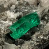 Beryl (variety emerald), Calcite<br />La Pita mining district, Municipio Maripí, Western Emerald Belt, Boyacá Department, Colombia<br />60x55x80mm, xl=6+8mm<br /> (Author: Fiebre Verde)