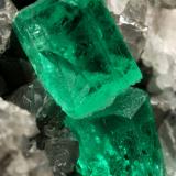 Beryl (variety emerald), Calcite<br />La Pita mining district, Municipio Maripí, Western Emerald Belt, Boyacá Department, Colombia<br />60x55x80mm, xl=6+8mm<br /> (Author: Fiebre Verde)