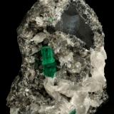 Beryl (variety emerald), Calcite<br />La Pita mining district, Municipio Maripí, Western Emerald Belt, Boyacá Department, Colombia<br />60x55x80mm, xl=6+8mm<br /> (Author: Fiebre Verde)