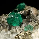 Beryl (variety emerald), Calcite, Pyrite, Albite (variety cleavelandite)<br />Chivor mining district, Municipio Chivor, Eastern Emerald Belt, Boyacá Department, Colombia<br />70x46x34mm, main xl=18mm<br /> (Author: Fiebre Verde)