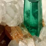 Beryl (variety emerald), Calcite, Parisite<br />La Pita mining district, Municipio Maripí, Western Emerald Belt, Boyacá Department, Colombia<br />8x8x8cm, H35mm, xl=8mm<br /> (Author: Fiebre Verde)