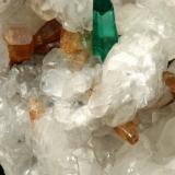 Beryl (variety emerald), Calcite, Parisite<br />La Pita mining district, Municipio Maripí, Western Emerald Belt, Boyacá Department, Colombia<br />8x8x8cm, H35mm, xl=8mm<br /> (Author: Fiebre Verde)