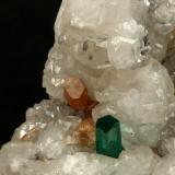 Beryl (variety emerald), Calcite, Parisite<br />La Pita mining district, Municipio Maripí, Western Emerald Belt, Boyacá Department, Colombia<br />8x8x8cm, H35mm, xl=8mm<br /> (Author: Fiebre Verde)