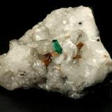 Beryl (variety emerald), Calcite, Parisite<br />La Pita mining district, Municipio Maripí, Western Emerald Belt, Boyacá Department, Colombia<br />8x8x8cm, H35mm, xl=8mm<br /> (Author: Fiebre Verde)