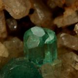 Beryl (variety emerald), Albite (variety cleavelandite)<br />Chivor mining district, Municipio Chivor, Eastern Emerald Belt, Boyacá Department, Colombia<br />64x39x53mm, main xl=23mm<br /> (Author: Fiebre Verde)