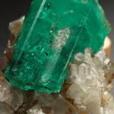 Beryl (variety emerald), Calcite<br />La Pita mining district, Polveros Mine, Municipio Maripí, Western Emerald Belt, Boyacá Department, Colombia<br />32x25x32mm, xl=25mm<br /> (Author: Fiebre Verde)