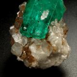 Beryl (variety emerald), Calcite<br />La Pita mining district, Polveros Mine, Municipio Maripí, Western Emerald Belt, Boyacá Department, Colombia<br />32x25x32mm, xl=25mm<br /> (Author: Fiebre Verde)