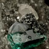 Beryl (variety emerald), Calcite, Dolomite<br />Muzo mining district, Western Emerald Belt, Boyacá Department, Colombia<br />triangle side=35mm, xl=11mm<br /> (Author: Fiebre Verde)