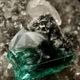 Beryl (variety emerald), Calcite, Dolomite<br />Muzo mining district, Western Emerald Belt, Boyacá Department, Colombia<br />triangle side=35mm, xl=11mm<br /> (Author: Fiebre Verde)