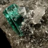 Beryl (variety emerald), Calcite, Dolomite<br />Muzo mining district, Western Emerald Belt, Boyacá Department, Colombia<br />triangle side=35mm, xl=11mm<br /> (Author: Fiebre Verde)